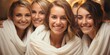 © Friedbert - A group of women in robes posing for a picture, group of female friends posing for a picture in spa.