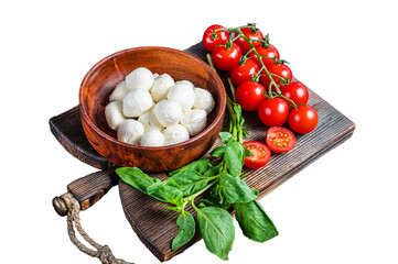 Wall Mural - Italian mini Mozzarella cheese balls, basil and tomato cherry ready for cooking Caprese salad Transparent background. Isolated.