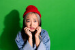 © deagreez - Top view photo of upset offended lady wear denim jacket arms hands cheeks empty space isolated green color background