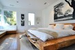 Rustic yet modern bedroom with a chunky wooden bed and a clean white wall