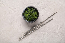 Bowl With Healthy Seaweed And Chopsticks On Grey Background