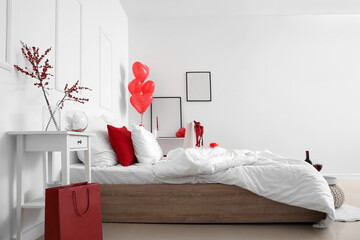 Canvas Print - Interior of light bedroom with heart-shaped balloons and red lingerie in shopping bag. Valentine's Day celebration