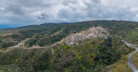 Sticker - drone perspective of the picturesque mountain village and church of Badolato in Calabria