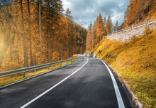 Road In Orange Forest At Sunset In Autumn In Dolomites, Italy