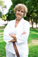 Wall Mural - Old lady in white kimono outdoors