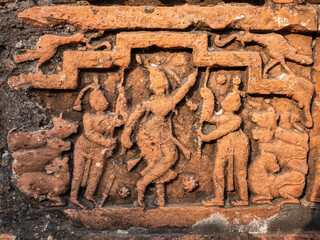 Wall Mural - Detail of ancient terracotta relief depicting Krishna Govardhana hindi legend on exterior wall of Chauchala Chhota Govinda temple, Puthia, Bangladesh