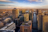 Fototapeta Londyn - Panoramic view of the skyscrapers at the financial district Canary Wharf of London, England, during sunset time