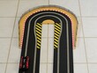 Hairpin bend on a slot car racing track. 