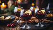 Christmas mulled red wine with spices and fruits on a wooden rustic table. Traditional hot drink at Christmas time