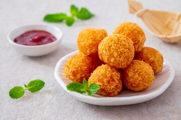 Wall Mural - Deep fried cheese balls on plate and ketchup