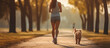 Girl on a morning jog with a dog in a summer park