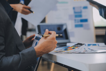 Close up ux developer and ui designer use augmented reality brainstorming about mobile app interface wireframe design on desk at modern office.Creative digital development agency