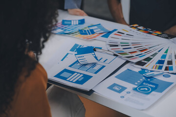 Close up ux developer and ui designer use augmented reality brainstorming about mobile app interface wireframe design on desk at modern office.Creative digital development agency