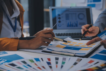 Close up ux developer and ui designer use augmented reality brainstorming about mobile app interface wireframe design on desk at modern office.Creative digital development agency