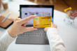 © thatinchan - business woman is using credit card to pay for products online when ordering products from store through an online website because using credit card to pay for products brings convenience in shopping