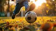 © Ilmi - close up boy kicking a soccer ball