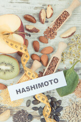 Wall Mural - Inscription hashimoto, tape measure and best ingredients for healthy thyroid. Food containing natural vitamins