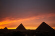 Panoramic view of Giza Pyramids at Sunset with colourful sky