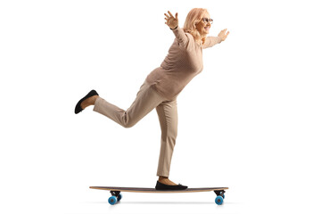 Poster - Middle aged woman riding a skateboard and spreading arms