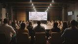 Fototapeta Desenie - Audience in a conference room or seminar meeting showing a presentation video