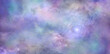 Beautiful colorful celestial cloudscape background banner - heavenly concept blue pink purple lilac ethereal deep space sky depicting the heavens above ideal for a spiritual theme

