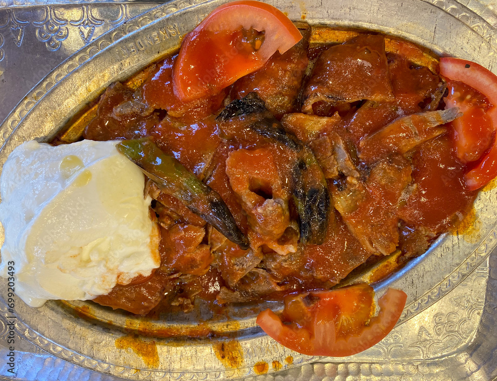 Traditional turkish iskender kebab in copper plate with yogurt, grilled ...