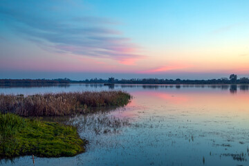 Beautiful lagoon landscape with birds in the Doñana National Park, Huelva, Anadalucia, Spain, at sunset