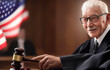 © MaxSafaniuk - Judge holding of Judge hammer in courtroom. Justice in courthouse on law theme and human right. Punishment verdict of judges in court. Mallet of judge in USA courthouse during sentencing and trial.