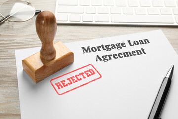 Wall Mural - Mortgage loan agreement with Approved stamp and pen on table, closeup