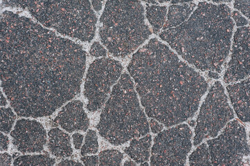 Wall Mural - Background, texture, top view of wet asphalt with cracks on the road. Photography, abstraction.