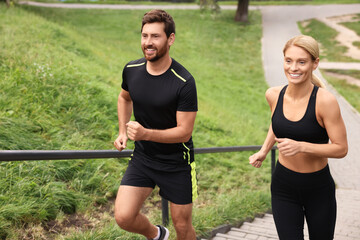 Sticker - Healthy lifestyle. Happy couple running up stairs outdoors