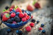 A bowl filled with fresh berries like strawberries, blueberries, sapberries and blackberries