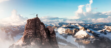 Adventure Man On Top Of Rocky Mountain Cliff. Aerial Canadian Mountain Landscape From British Columbia
