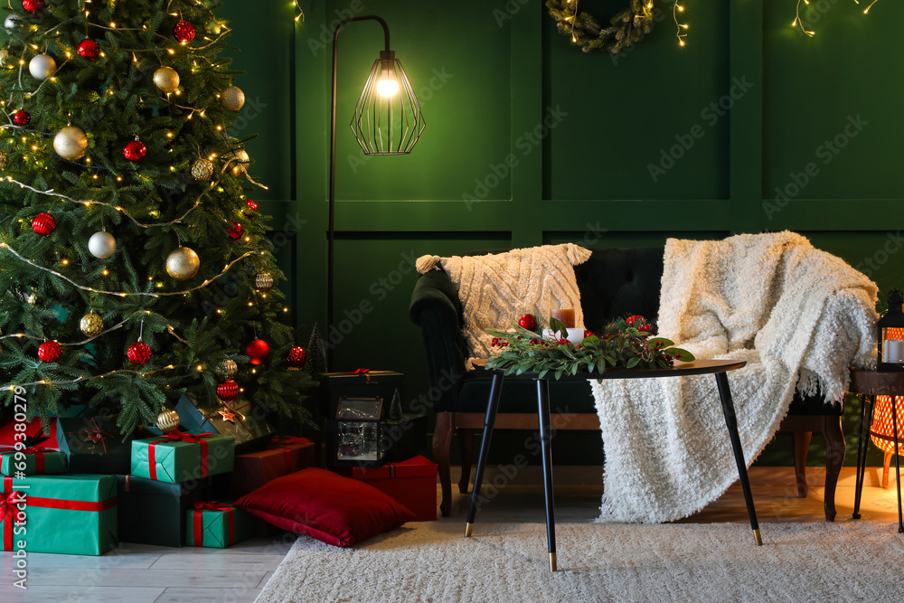 Interior of living room with Christmas tree, gift boxes, sofa and glowing lights