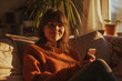 © 361 Portrait Studio - Portrait of beautiful happy young woman using her smart phone relaxing sitting on a sofa in living room