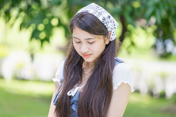 Portrait of A teenage girl at park, Young Asian teen woman enjoying outdoor