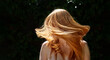 © ullision - wide panorama banner of unrecognizable beautiful sexy redhead woman ginger portrait, shaking her flying long red hair against the dark ivy background in sunny backlight