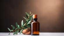 Eucalyptus Essential Oil In Brown Glass Bottle On Blurred Background With Green Leaves And Dropper