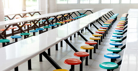 Wall Mural - School cafeteria with white tables and colorful seats