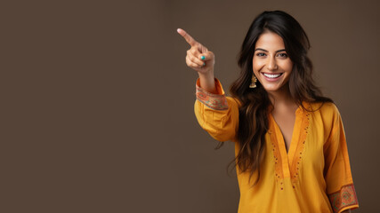 Happy indian woman pointing her finger at copy space for promotion