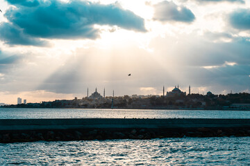 Istanbul background photo. Historical peninsula and sunrays with dramatic clouds