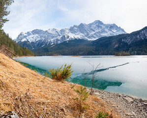 frozen lake Eibsee with view to Zugspitze mountain and isolas, upper bavaria