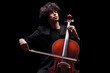 Young male artist playing a cello