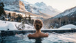 Young  woman resting in hot tub with view on mountains in winter