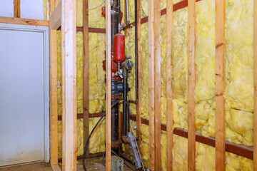 Wall Mural - In construction of new home, fiberglass insulation mineral rock wool are installed to wall