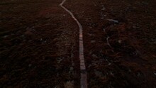 Aerial View Of A Hiking Path Leading Through Moorland Into A Beautiful Winter Sunset. Yorkshire Dales.