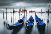 Three Gondolas Moored With The Church Of San Giorgio Maggiore In The Distance, Venice, Veneto, Italy