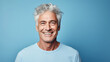 © FATHOM - Happy smiling middle aged adult man on a solid background