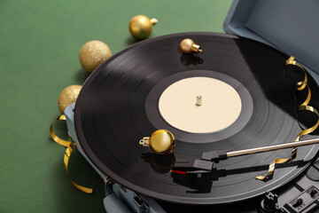 Poster - Vintage turntable with Christmas decorations on green background