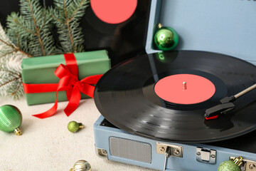 Wall Mural - Vintage vinyl record player with Christmas gift and decorations on white grunge background